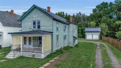 Wood-Sided Duplex With Garage