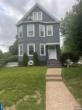 Well-Maintained Two-Family Corner Home