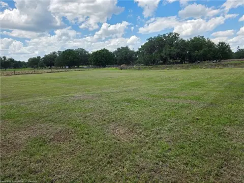 Fenced Farmland with Pond