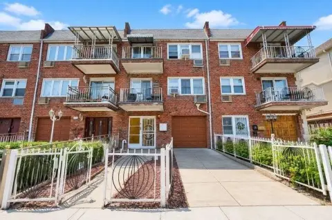 Brick Triplex With Attached Garage