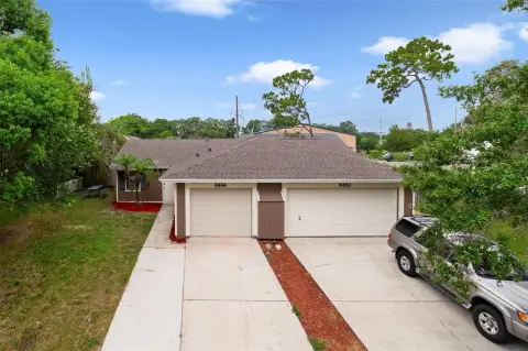 Contemporary Duplex Home with Fenced Yard
