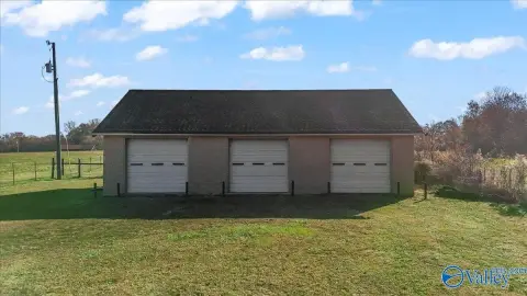 Unrestricted Land with 3-Bay Shop