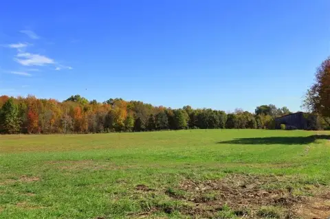 Farmland with Pond and Barn