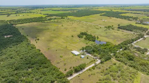 Fenced Ranch Acreage with Pond