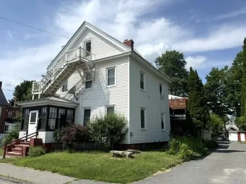 Apartment Building with Attached Two-Level Unit