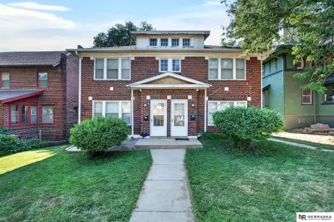 Brick Duplex With Detached Garages