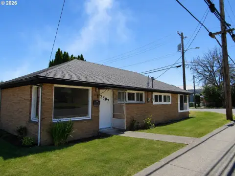 One-Level Brick Duplex with Carport