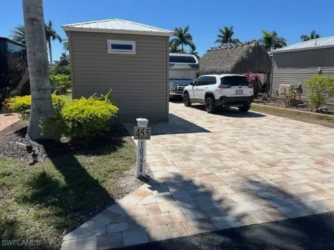 Paver-Covered Lot with Tiki Hut