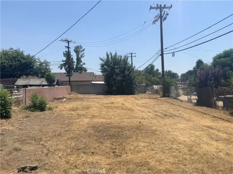 Fenced Vacant Commercial Lot