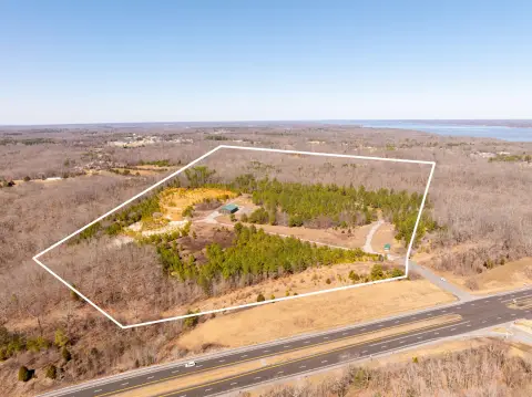 Wooded Waterfront Land with Metal Building