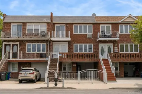 Brick Triplex With Attached Garage