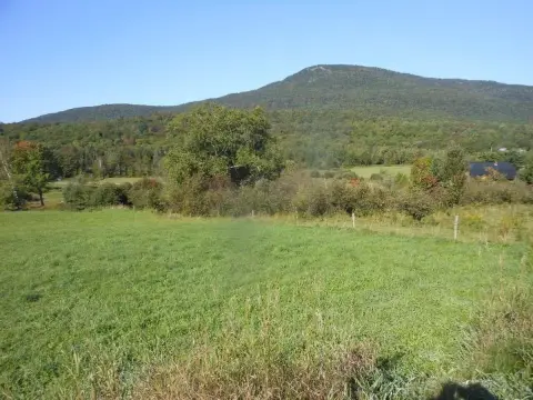 Land with Mountain and Lake Views
