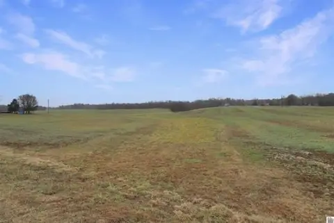 Tillable Farmland with Tobacco Barns