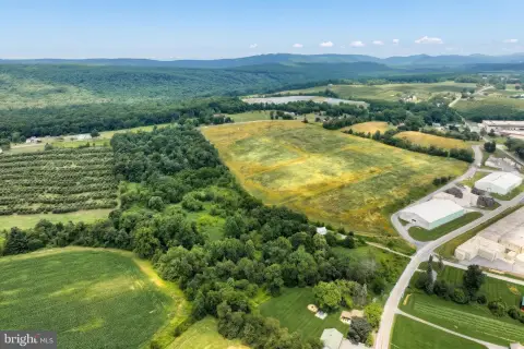 Rural Wooded Land with Farmhouse