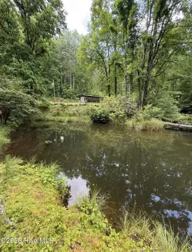 Unrestricted Waterfront Land with Pond