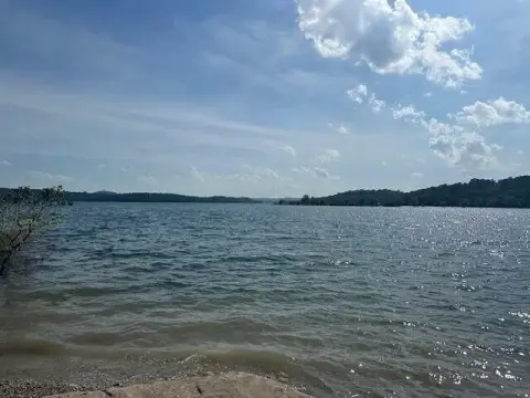 Lakefront Lot with Unfinished Cabin