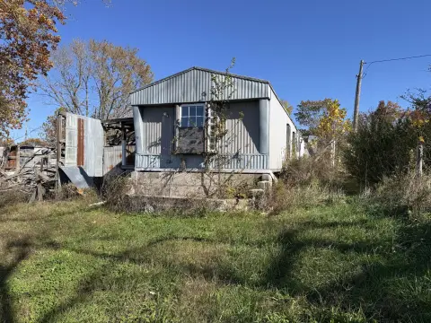 Land with Non-Livable Mobile Home