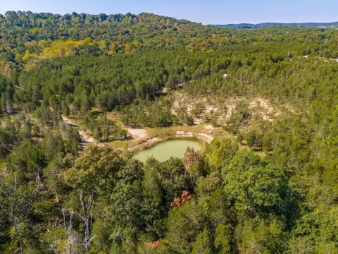 Private Wooded Acreage with Pond