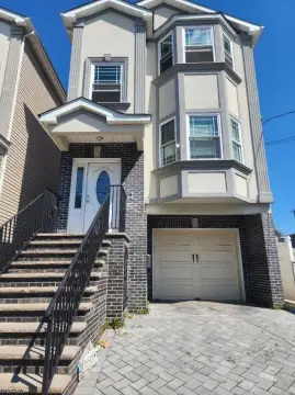 Modern Two-Family Home with Fenced Yard