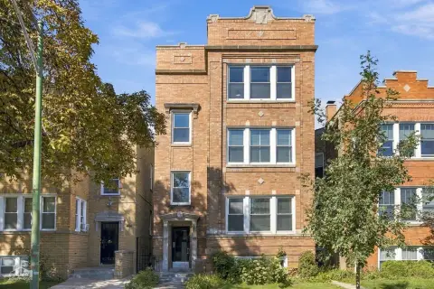 Brick Triplex with Sunrooms