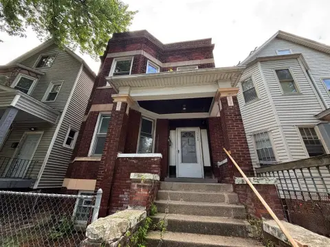 Brick Duplex with Enclosed Porch