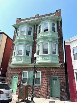 Brick Quadplex with Bay Windows