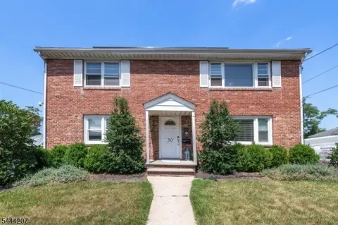 Updated Two-Family Residence with Backyard