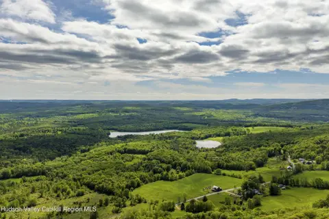 Land with Mountain and Water Views