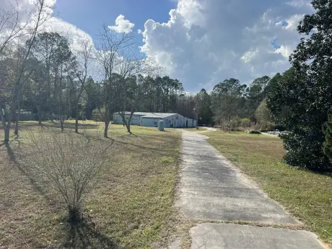 Land with Pond and Shops