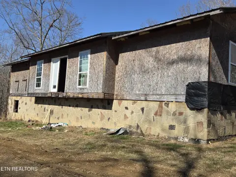 Land with Partially Finished House