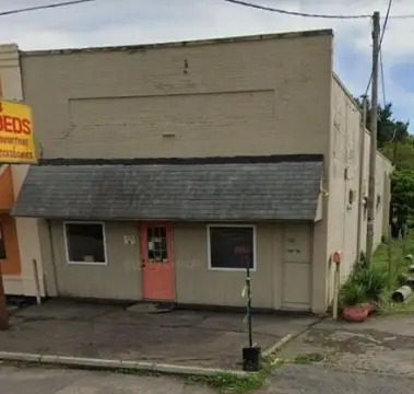 Brick Storefront with Parking Lot
