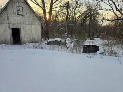 Heavily Wooded Land with Pond