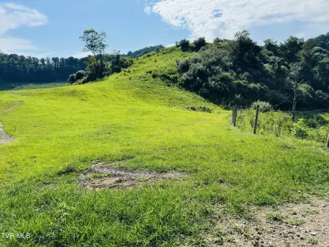 Fenced Agricultural Land with Pond