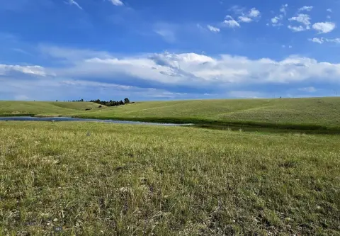 Rolling-Hill Land with Pond