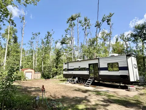 Wooded Waterfront Land with Travel Trailer