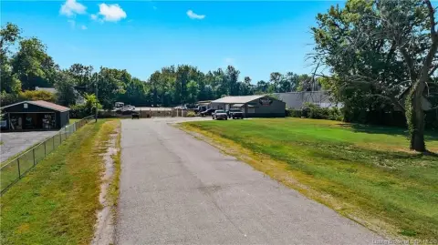 Fenced Commercial Yard with Pole Barn