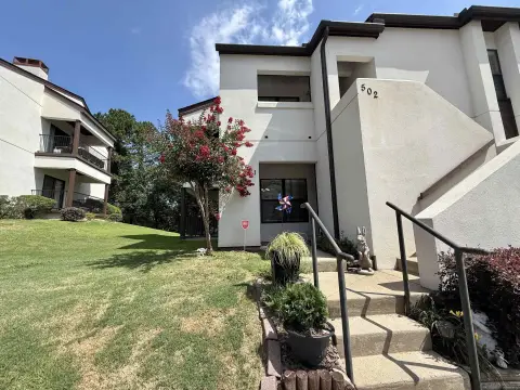 Downstairs Residential Income Condo with Fireplace
