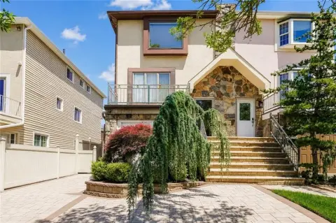 Updated Semi-Attached Two-Family Home