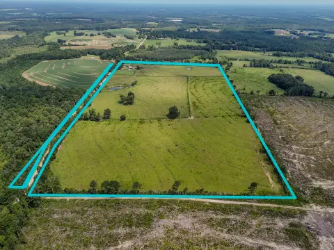 Fenced Cattle Farm with Farmhouse