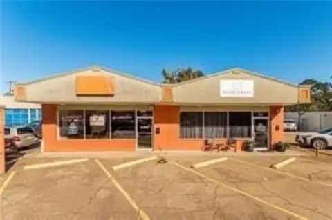 Tenant-Occupied Storefront Building