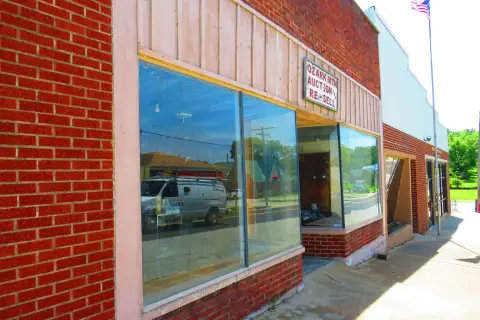 Retail Storefront with Roof Needs Replacement