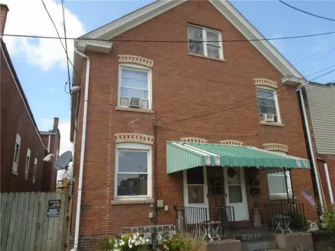 Brick Quadplex with Coin-Operated Laundry