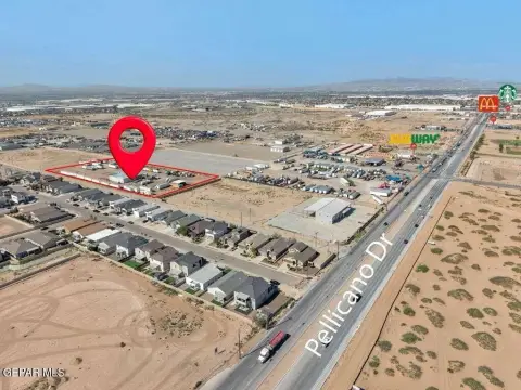 Fenced Commercial Land with Open Structures