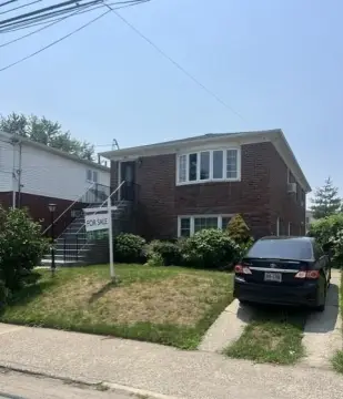 Detached Brick Two-Family Home with Driveway