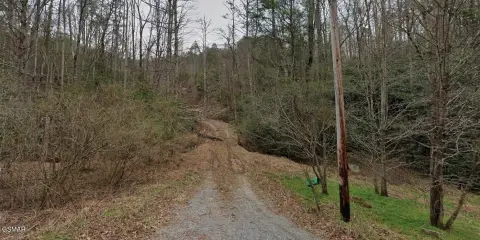 Wooded Mountain Acreage with Creek