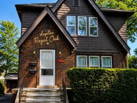 2-Unit Tudor Duplex with Sunrooms