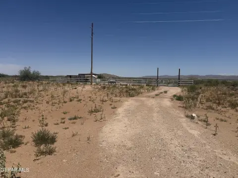 Fenced Half-Acre Development Lot