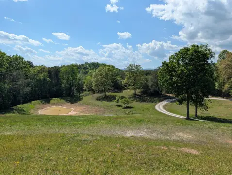 Unrestricted Rolling Acreage with Pond