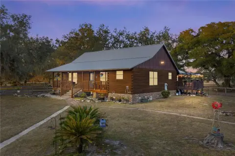 Bushnell Acreage with Log Cabin