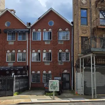 Brick Triplex With Driveway